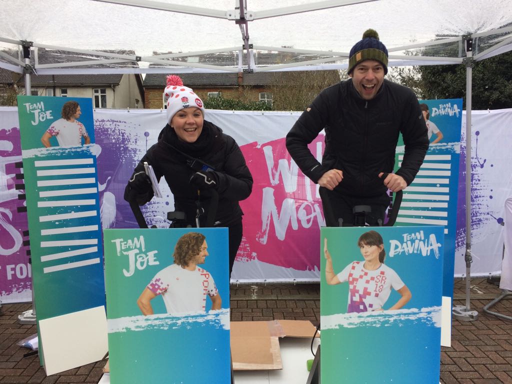 Leaderboard outside on a trade stand with exercise bikes