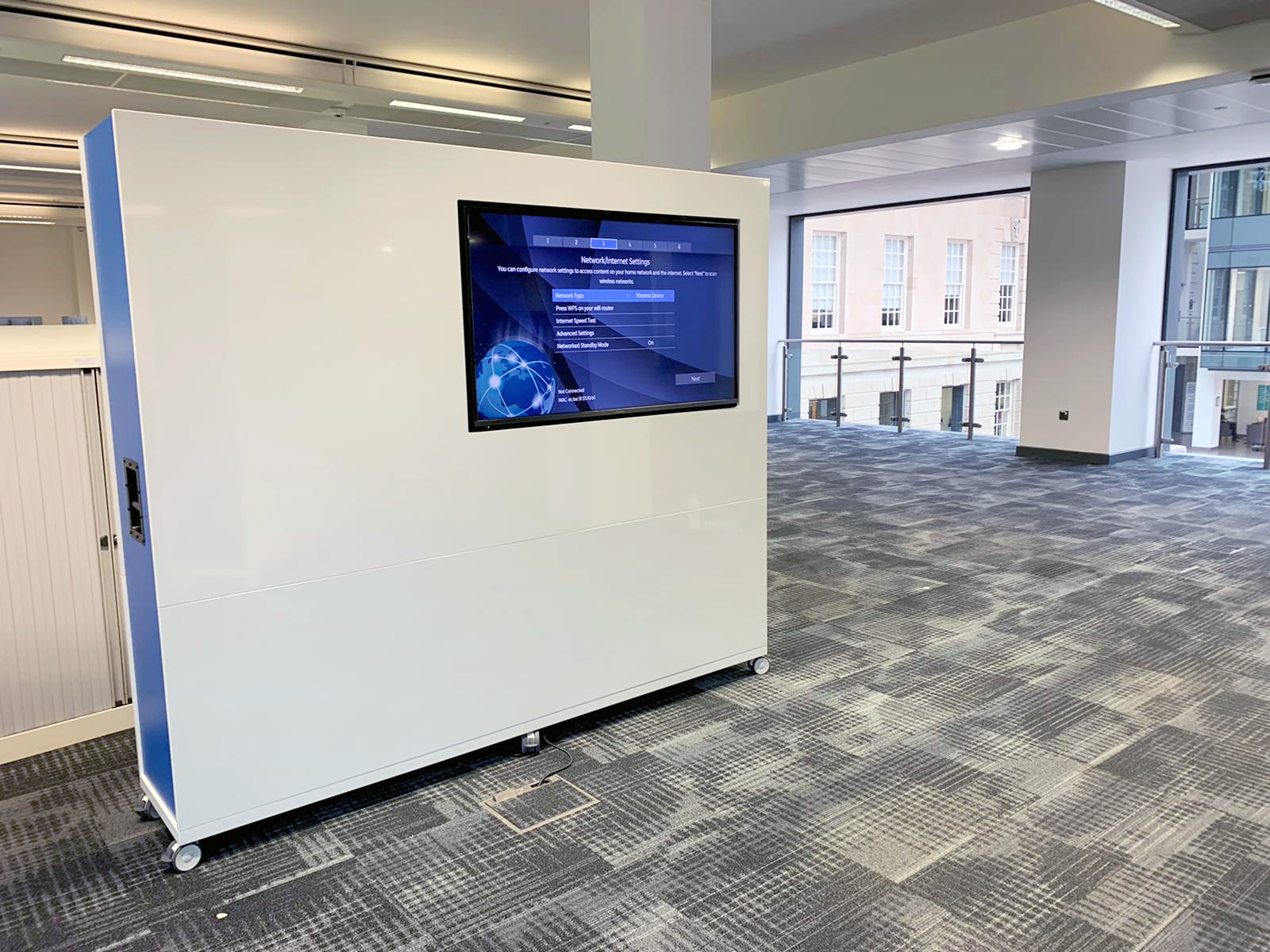 Mobile whiteboard wall with built in tv screen