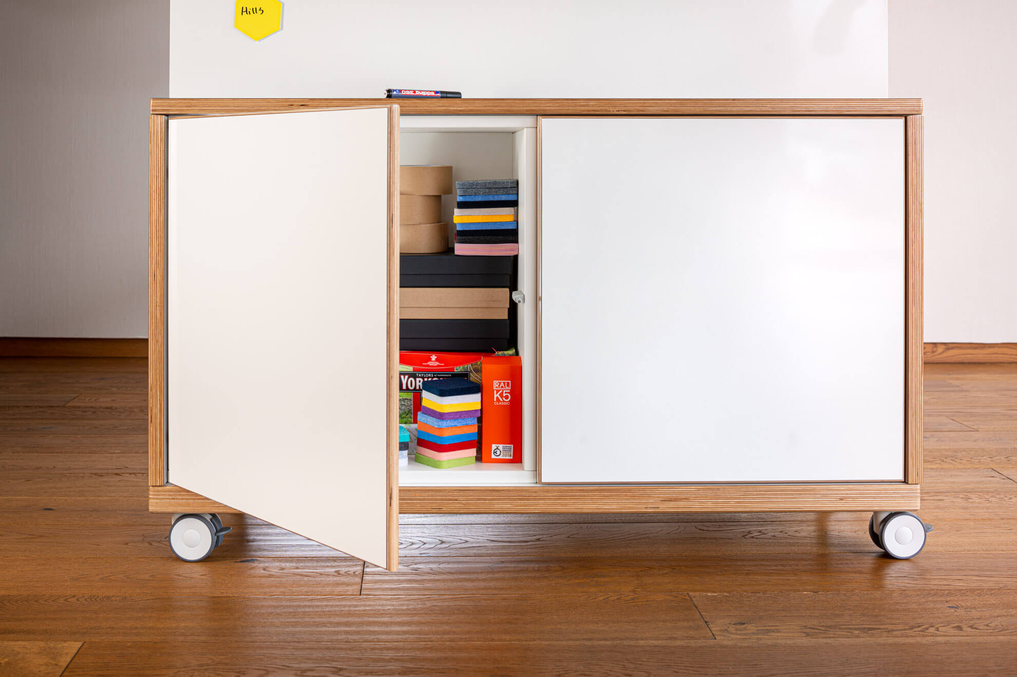 Mobile whiteboard wall with built in cupboards