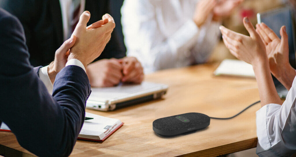 Young business man with a group of business people. They productively completed the negotiations in the office. Close-up shot