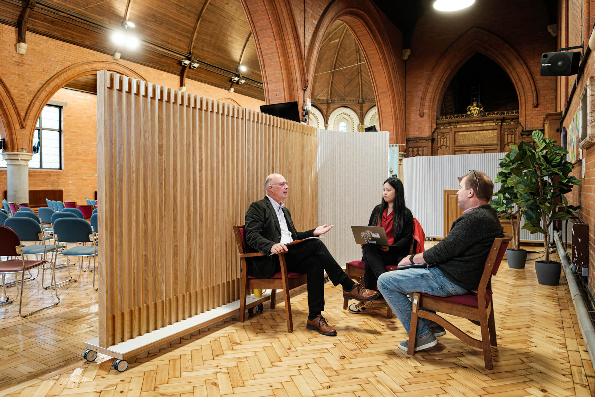 Partitioning provides privacy for a church meeting